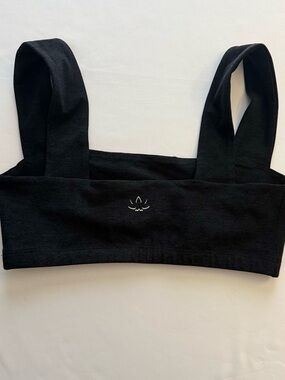 Beyond Yoga Black sports bra with White Lotus Logo
